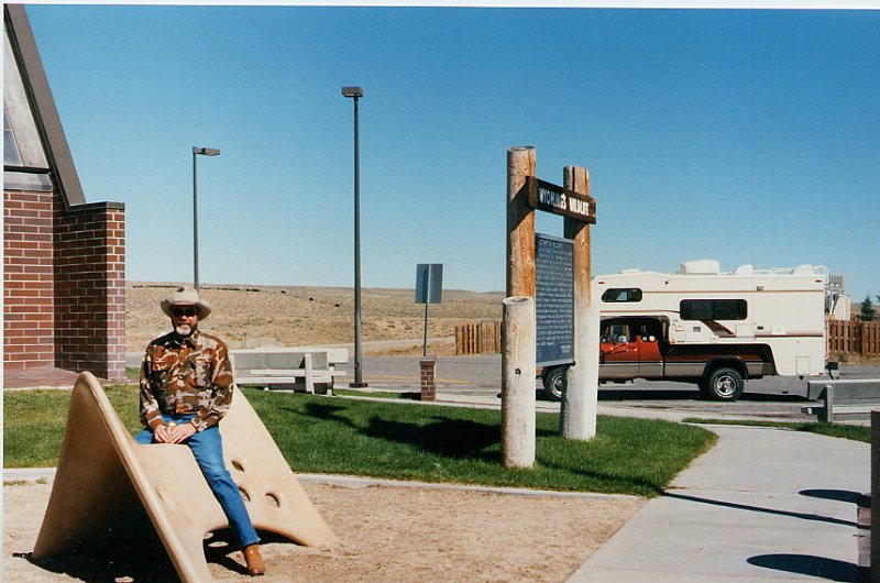2000-03_0424.jpg - Bob at the Rest Area with camper in background